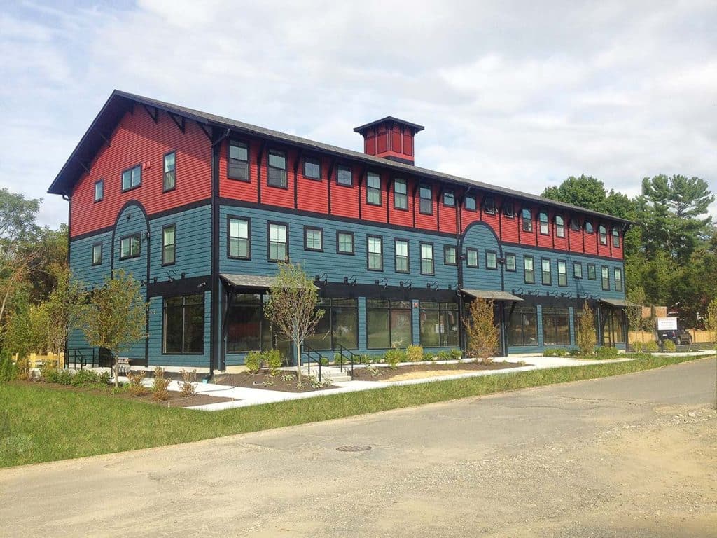 Photograph of The Trolley Barn, a three-story mixed-use building designed by Kuhn Riddle Architects and constructed by Integrity Development & Construction in Amherst, MA.
