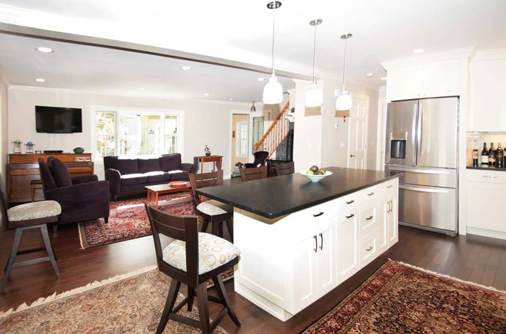 Interior photograph of a kitchen, bathroom, and living space renovation completed by Integrity Development & Construction in Whately, MA.