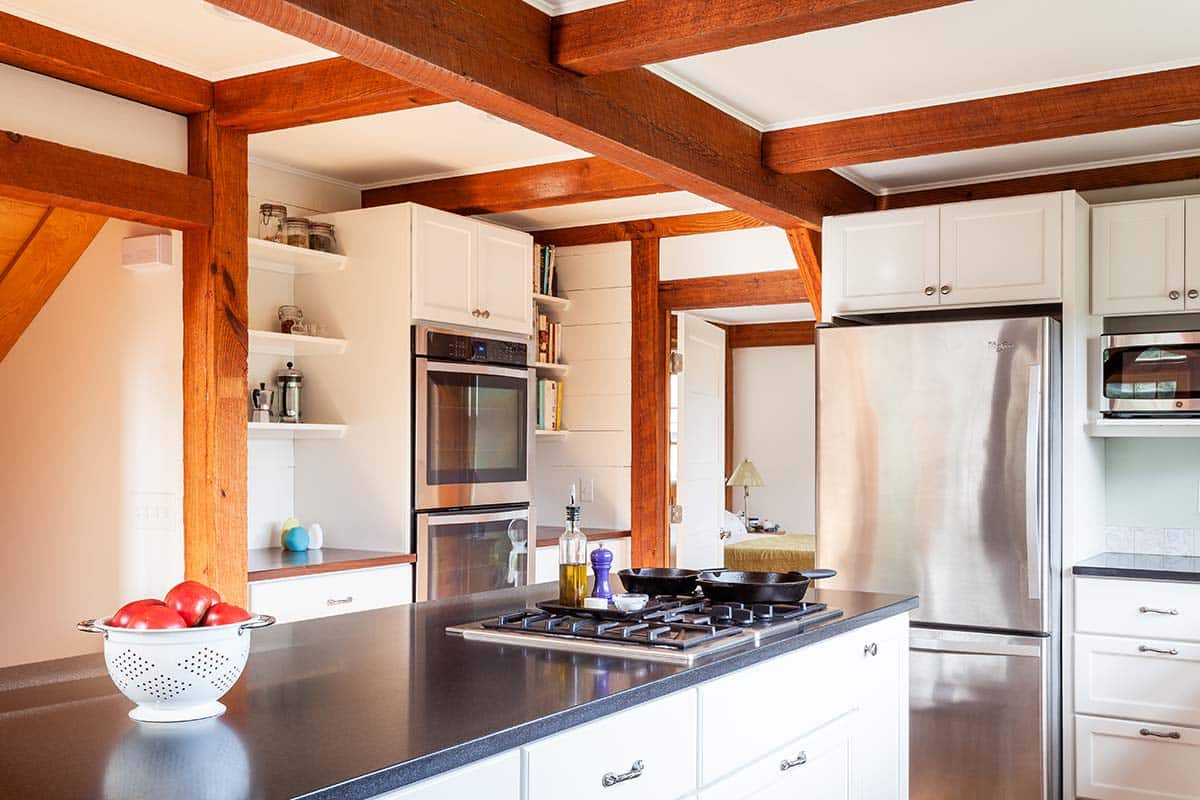 Photograph of a post-and-beam home renovation including a garage and studio addition, mudroom addition, and kitchen and bathroom remodeling completed by Integrity Development & Construction in Conway, MA.