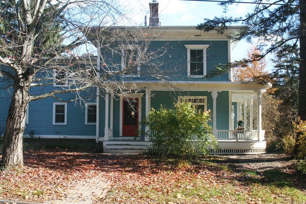 Photograph of a historic porch restoration completed by Integrity Development & Construction in Amherst, MA.