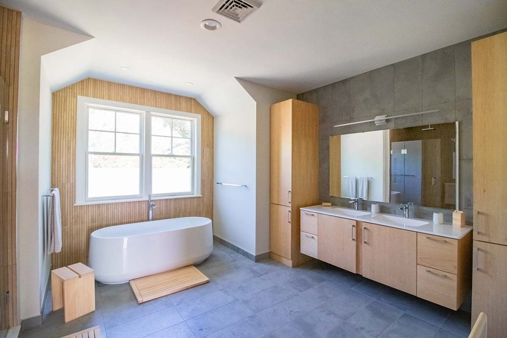 Photograph of a kitchen, primary bathroom, and deck renovation completed by Integrity Development & Construction in Amherst, MA.