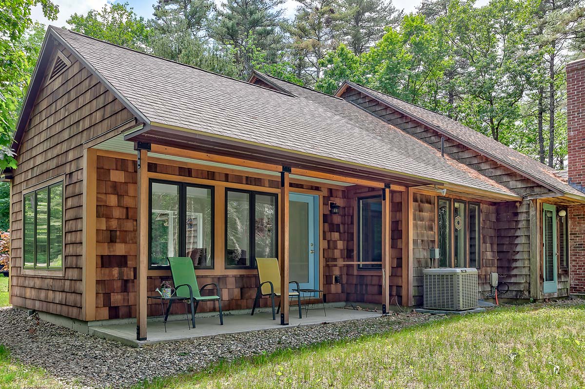 Photograph of a custom sunroom addition completed by Integrity Development & Construction in Leverett, MA.