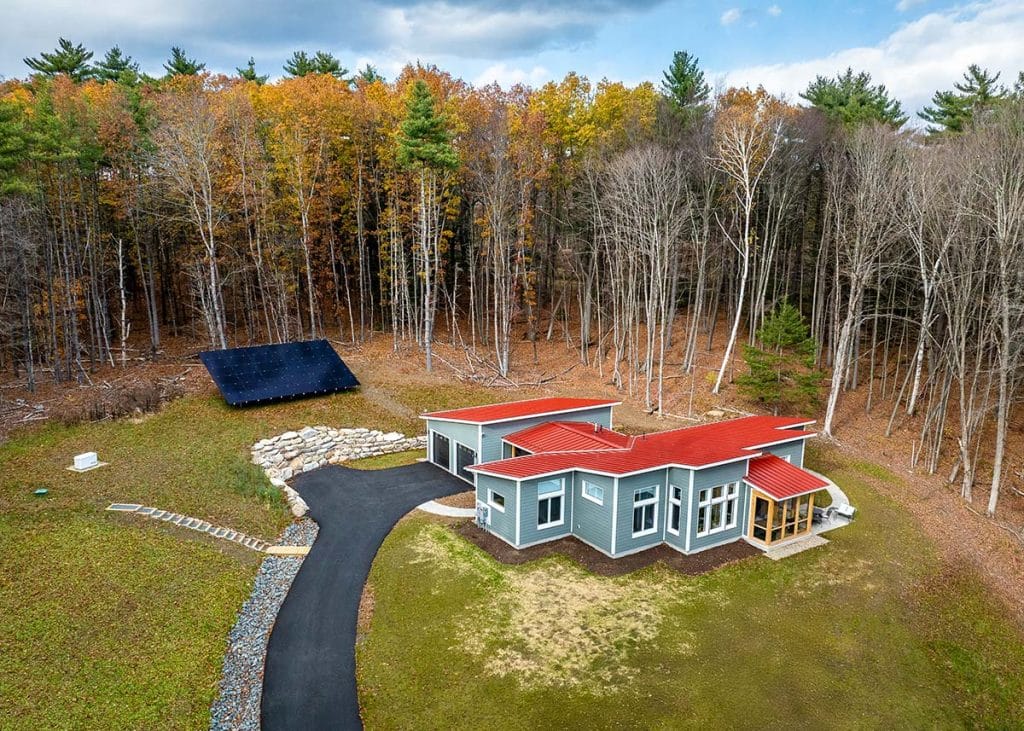 Photograph of an Aging-in-Place Unity Home featuring an attached garage and outdoor shower built by Integrity Development & Construction in Gill, MA.