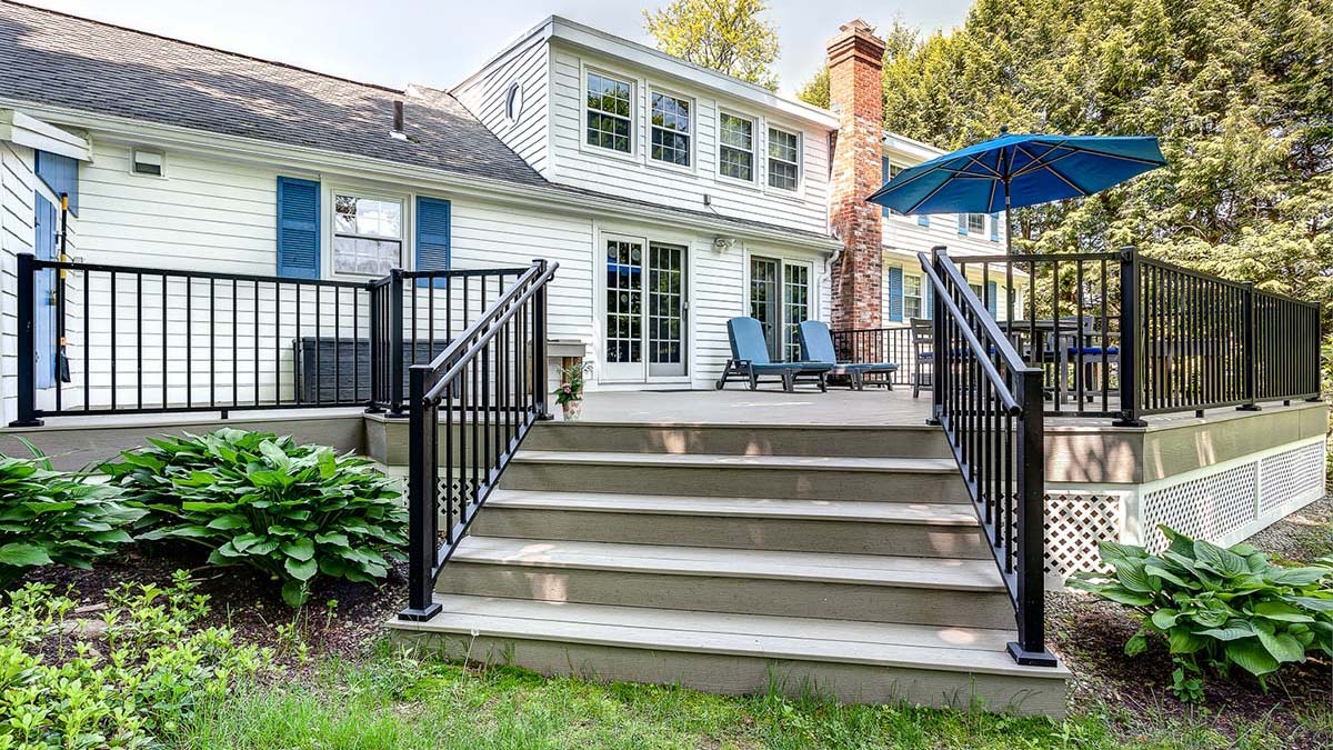 Custom home with a spacious composite deck and outdoor living space representing Integrity Development & Construction's residential portfolio.