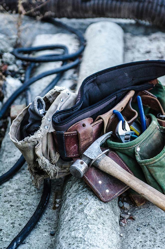 History Timeline 11 Tools and a tool pouch reflecting Integrity's workforce development work