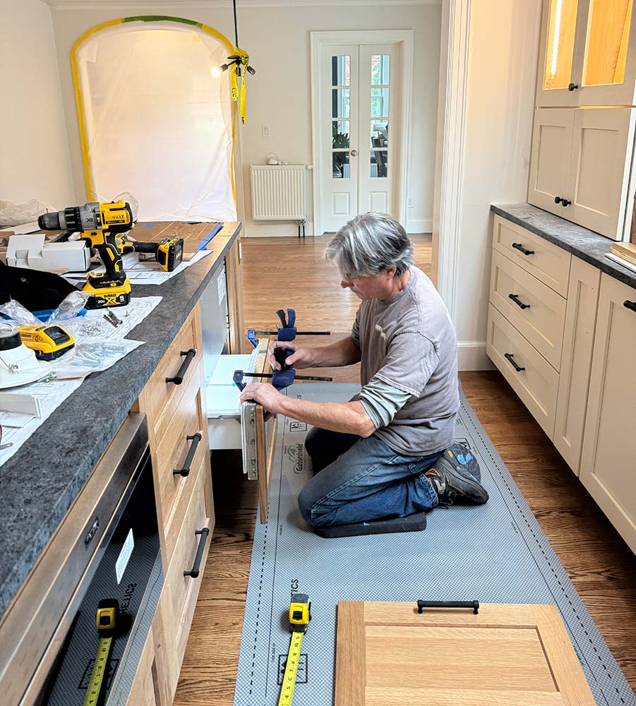 Integrity crew member working on site, finishing a kitchen remodel