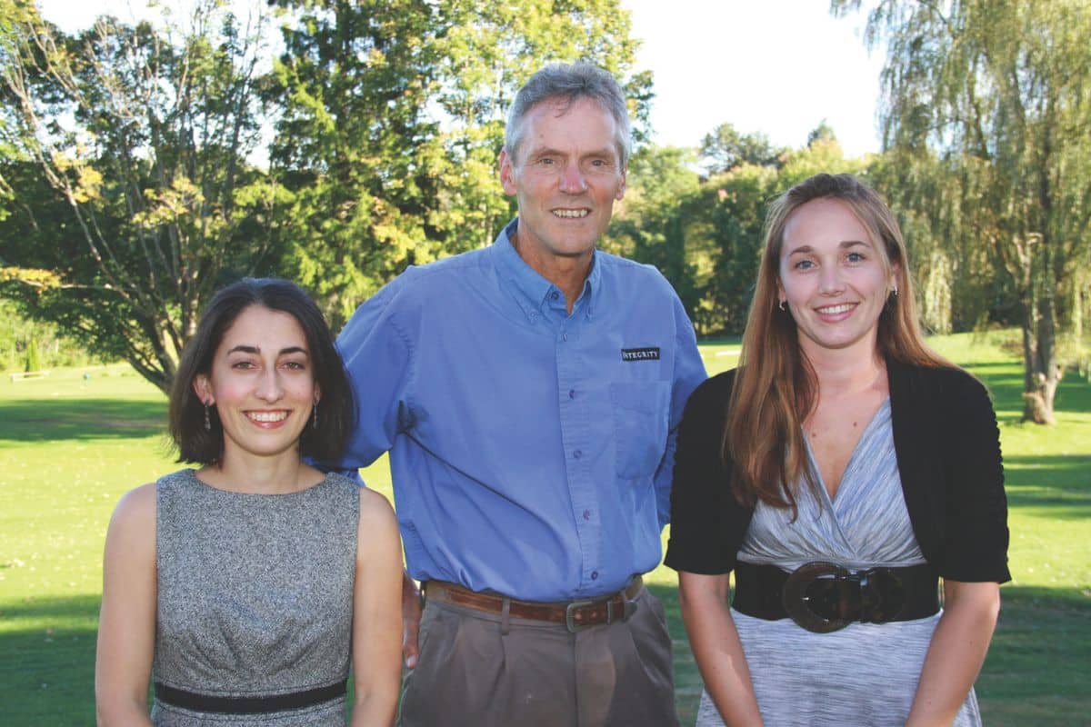 Portrait of two women and a man - the new owners of Integrity with the founder